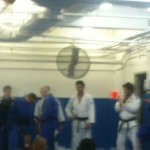 Prof. John Danaher receives a stripe from Prof. Renzo. Prof. John Danaher receives a stripe from Prof. Renzo.